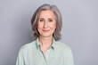 © deagreez - Photo of mature positive smiling beautiful businesswoman secretary wear green shirt isolated on grey color background