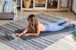 © simona - Sporty woman rest after exercise workout at home using laptop computer and online class personal trainer - healthy female people lifestyle and daily fitness session