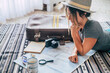 © simona - Caucasian woman planning vacation travel with map and guide at home, female people plan next holidays vacation while relaxing on the floor - pretty girl wanderlust concept