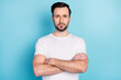 © deagreez - Portrait of attractive sporty fit serious guy gym expert coacher folded arms isolated over blue pastel color background