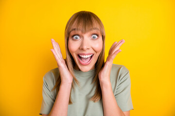 Poster - Close-up portrait of nice charming amazed cheerful girl having fun great news isolated over bright yellow color background