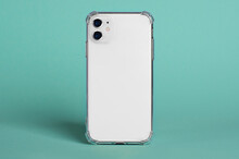 White Smartphone In Clear Silicone Case Back View. IPhone 11 Case Mockup Isolated On Green Background