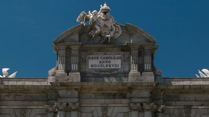 Wall Mural - The Puerta de Alcala timelapse (Alcala Gate) with flowers and traffic is a Neo-classical monument in the Plaza de la Independencia (Independence Square) in Madrid, Spain.