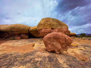 Sticker - Desert with yellow soil and big stones under a cloudy sky