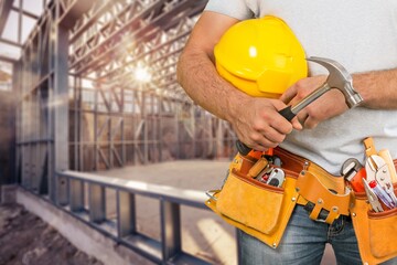 Wall Mural - Man worker or professional builder with tools