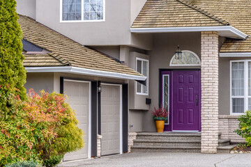 Fragment of a luxury house with entrance door and nice window.