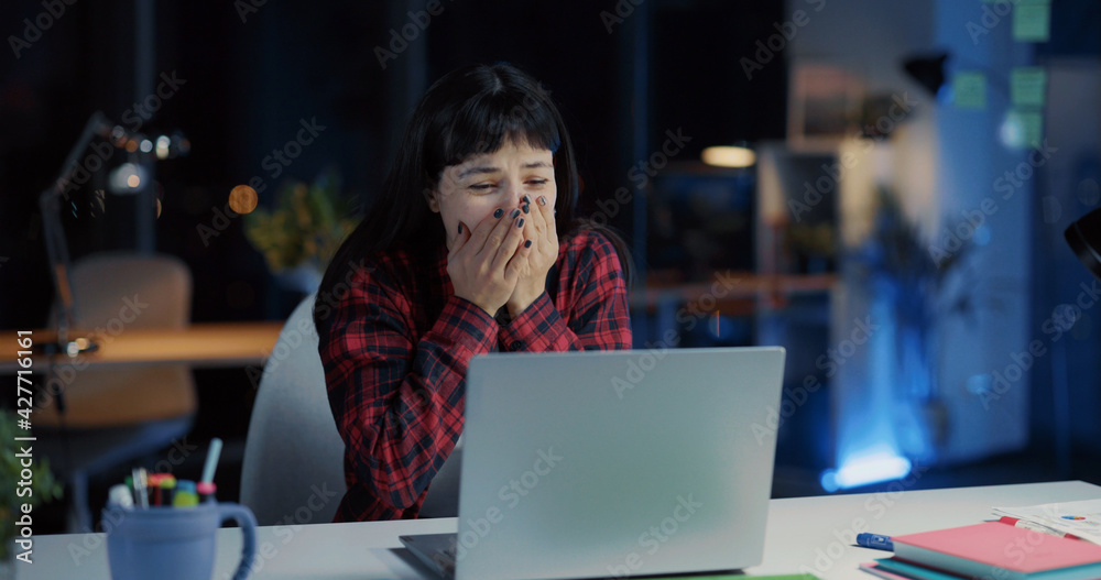 Excited young happy caucasian businesswoman doing project on laptop receiving good news notification smiling and celebrating victory success. - obrazy, fototapety, plakaty 