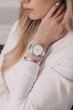 Beautiful elegant white watch on woman hand