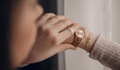 Beautiful golden watch on woman hand