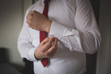 Closeup Shot Of A Man Wearing A White Shirt With A Red Tie