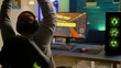 © DC Studio - Videogamer playing graphics cyber space sitting on gaming chair using technology network wireless. Man streaming video games online for fun using RGB equipment for online championship