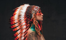 Tattooed Trendy Woman Wearing National Headwear From Feathers