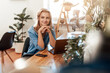© Fxquadro - Thoughtful young woman poses in office room with laptop at table