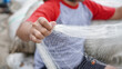 © HumbaFrame - Portrait of a young male fisherman preparing a fishing net in beach
