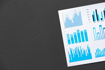 Wall Mural - Top view of printed diagrams on paper lying on table