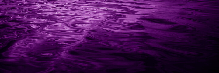 Wall Mural - Abstract purple background. Reflection of light on a wavy water surface. Ripples. Beautiful magenta background with copy space for design. Web banner.