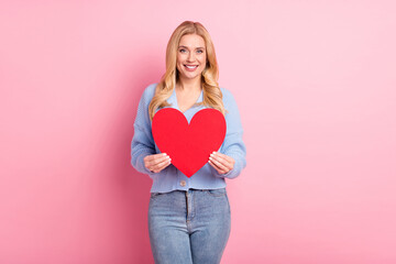 Sticker - Photo portrait of woman pretty cheerful showing red heart love symbol isolated on pastel pink color background