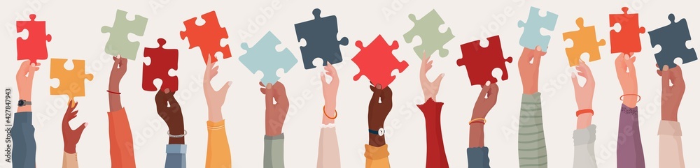  Group of multi-ethnic business people with raised arms holding a piece of jigsaw. Colleagues of diverse races and culture. Cooperate and collaborate. Concept of teamwork and success - obrazy, fototapety, plakaty 