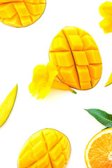 Wall Mural - Ripe chopped mango on white with yellow flowers. Vegan beautiful dessert layout on white. Isolated image