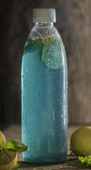 Canvas Print - Blue lagoon mocktail in bottle