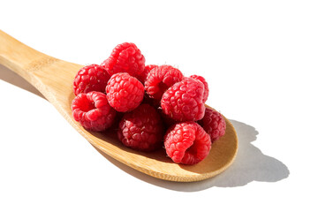 Fresh juicy sweet tasty raspberries on a wooden bamboo spoon. Isolated on white background. 