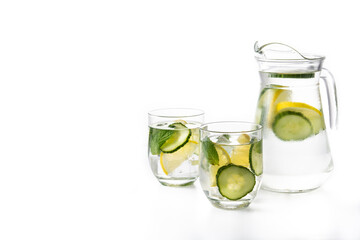  Sassy water or water with cucumber and lemon isolated on white background. Copy space
