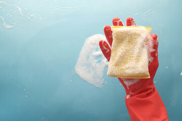 Sticker - hand with rubber gloves holding sponge 