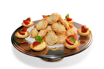 Pasta di meliga, cookies made with corn flour and butter on steel plate with strawberry pastries. Piedmontese biscuits, Italy, Isolated on white