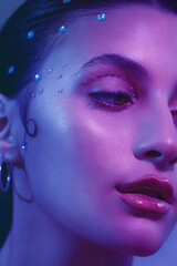 Photography of beauty inspirated in serie Euphoria, whith color purples nad blues, in home, in studio, portrait of woman with lights 