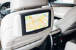 Modern car multimedia control system with navigation map mode at the headrest of the seat 