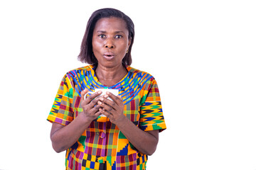 surprised mature woman holding a cup of coffee.