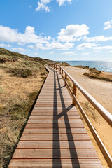 Wall Mural - wooden boardwalk along the rotes kliff (red cliff), sylt, schleswig-holstein, germany
