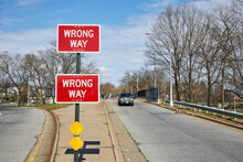 Wrong Way Sign On The Road
