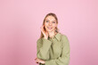 © Анастасия Каргаполов - Pretty european woman in casual sweater on pink background confident and calm smiling