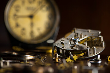 details of old watches. retro style. spare parts for watches on a wooden surface. repair, sales or maintenance concepts. watch, details mechanisms, count time. macro photo, background, place for text