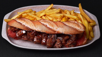 Canvas Print - Top view of steak sandwich with french fries on a plate