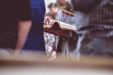 Woman Reading The Bible During A Church Gathering