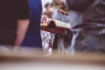 Woman reading the Bible during a church gathering