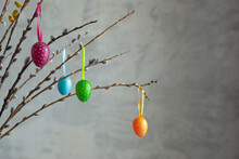 Easter Eggs On A Gray Background.colorful Easter Eggs Decorate The Willow Branches