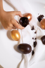 Golden Chocolate Easter Eggs On A White Bowl