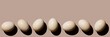 © The Picture Pantry - Chicken eggs on beige background copy space