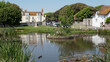 Glorious view of the Rottingdean pond on a bright sunny day in summer