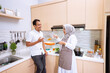 © Odua Images - happy muslim couple cooking together in the kitchen. man and woman preparing for dinner