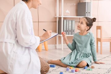 Poster - Female psychologist working with little girl at home