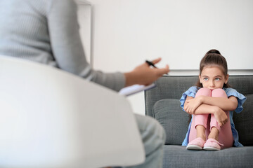 Poster - Sad little girl at child psychologist's office