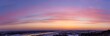 Zimowy zachód słońca z widokiem na panoramę Sandomierza widziany z Gór Pieprzowych, województwo świętokrzyskie