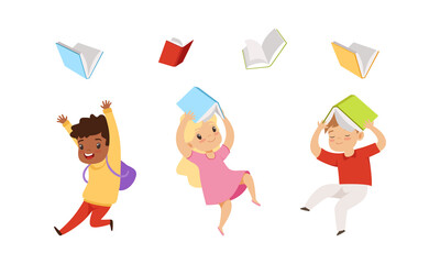 Wall Mural - Cute Kids Jumping with Joy and Throwing Books Up in the Air Vector Set