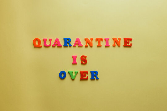 The concept of ending the quarantine. the word quarantine on a yellow background