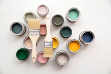 Overhead View Of A DIY Paint Brush With Colorful Sample Paint Pots