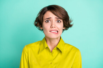 Poster - Portrait of attractive scared miserable girl biting lip bad news isolated on bright blue color background